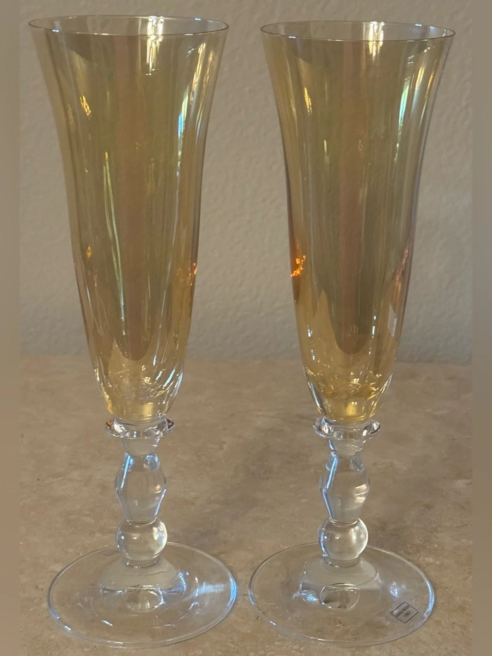 Pair of Vintage Iridescent Amber Fluted Champagne Glasses with Clear Stem.